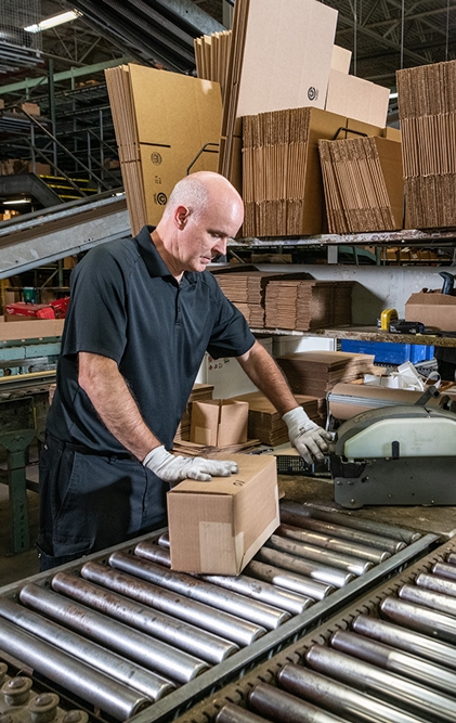 A Merit Brass team member collecting product to fulfill a customer order